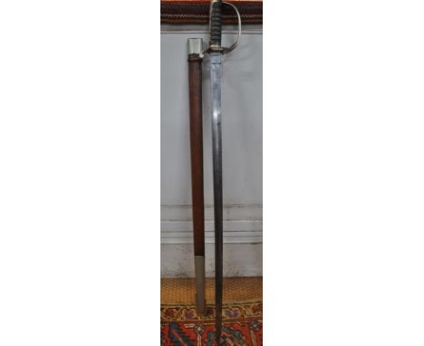 A Royal Artillery sword with 88 cm etched blade, open work basket hilt and wired fishskin handle, in leather scabbard, T. McB
