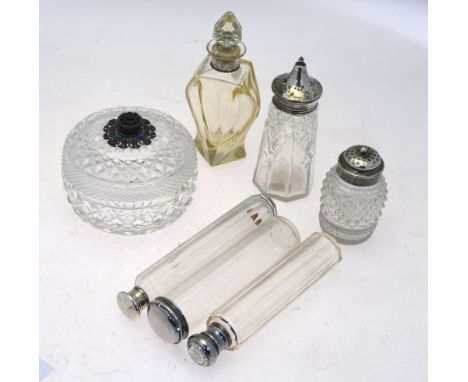 An Art Deco style glass scent bottle, the Sterling collar modelled with a buckle, to/w six other glass-topped vessels with si