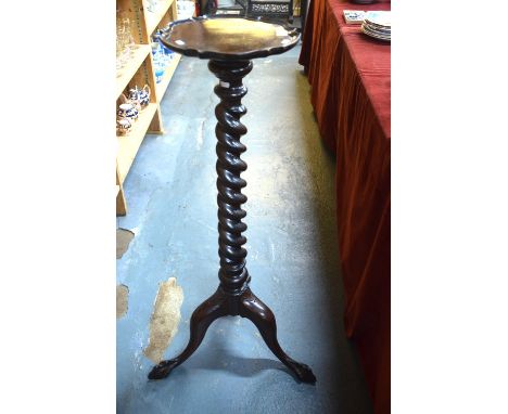 A Georgian style mahogany spiral column jardiniere stand raised on a tripod base with claw and ball feet, 106 cm high x 30 cm