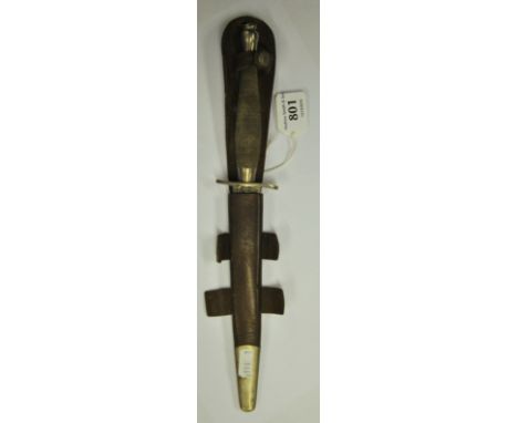 A scarce WWII Fairburn Sykes 1st pattern commando knife by Wilkinson Sword, the diamond cut grip with 2" wavy guard, the blad