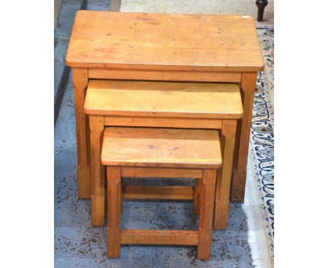 Wilf 'Squirrel Man' Hutchinson, an oak nest of three graduated occasional tables raised on octagonal supports united by stret