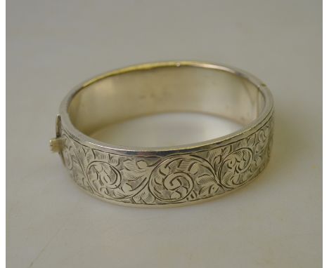 A half-engraved hollow silver hinged bangle Condition Report Bruised