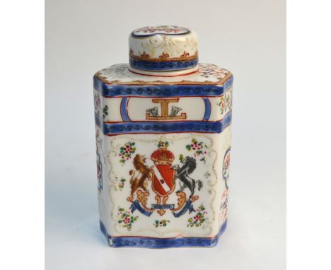 A 19th century Samson porcelain chamfered rectangular tea caddy and cover decorated in the Chinese famille rose armorial styl