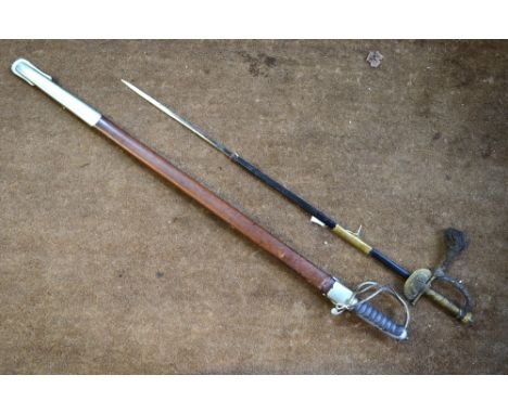 A Victorian court-sword with 79 cm etched blade, gilt hilt and partial leather scabbard to/w a George V military sword with 8