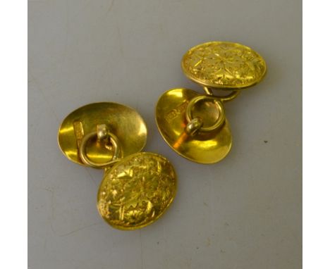 A pair of 18ct yellow gold oval engraved cufflinks approx 10g