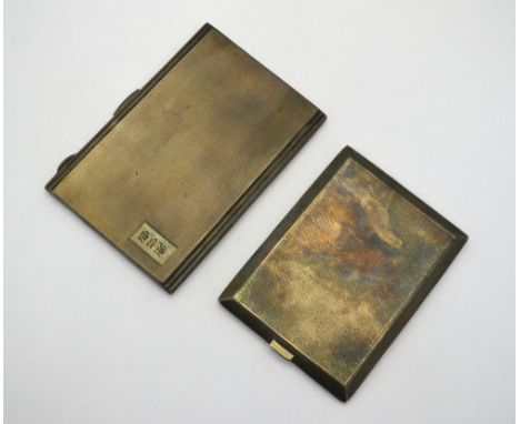 A heavy quality engine-turned silver cigarette case, Bravingtons Ltd, Birmingham 1940, to/w another cigarette case, Birmingha