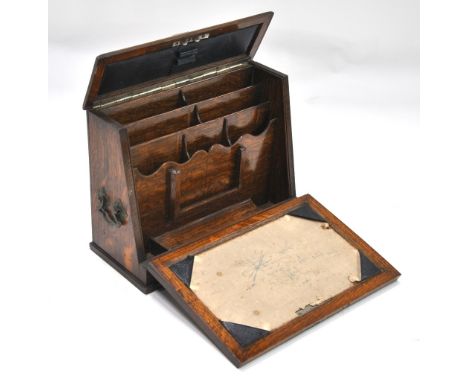 An oak writing box with hinge down front panel revealing stationery interior, to/w a Regency brass inlaid mahogany tea caddy 