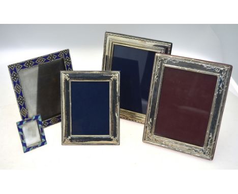 Two embossed silver-faced photograph frames, 23 x 17 cm, and another stamped 925, 18 x 14 cm, to/w a French electroplated fra