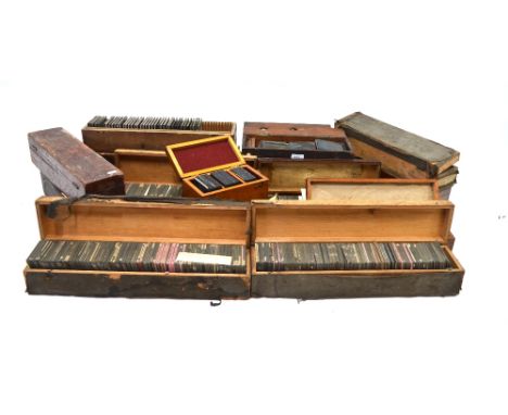 Over 700 magic lantern slides including topography, education, religion, in wooden boxes