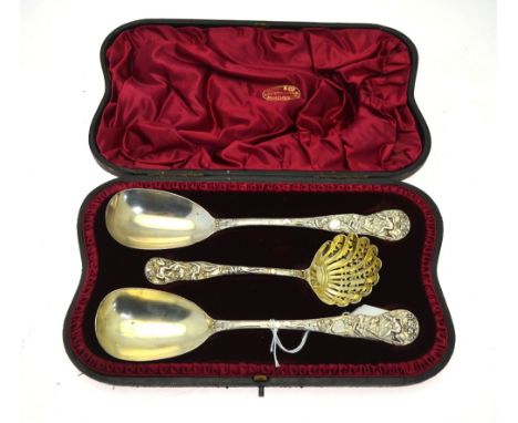 A Victorian cased set of heavy quality parcel gilt and silver serving spoons, the handles chased with Bacchanalian scenes, co
