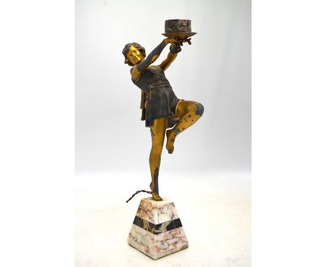 An Art Deco spelter lamp modelled as a dancing girl (lacks ball shade), with parcel gilt decoration, on marble base, 40 cm a/