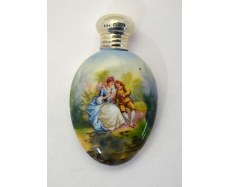 An Edwardian oval small scent flask, decorated with a courting couple, with silver screw bun cover, Birmingham 1904