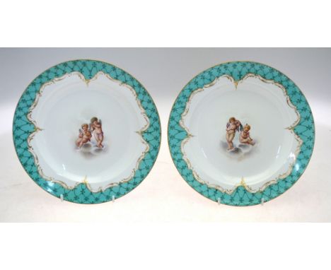 A pair of Meissen shallow dishes, turquoise ground, painted to the centre with cherubs playing musical instruments on clouds 
