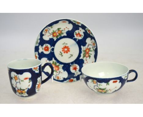 A Worcester powder-blue ground trio, comprising: a teacup, 8.5 cm diameter; a coffee cup, about 6.5 cm high; and a saucer, 13