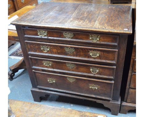 An 18th century oak chest of four long graduated drawers having applied moulded edges and raised on shaped bracket feet, 90 c