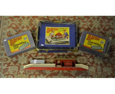 A boxed Bayko Building Set and two 2X converting sets, to/w a 00 scale train station  