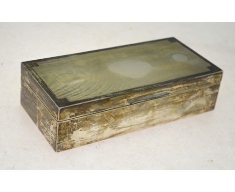 An engine-turned silver cigarette box, William Comyns & Sons Ltd, London 1929, 20 cm wide