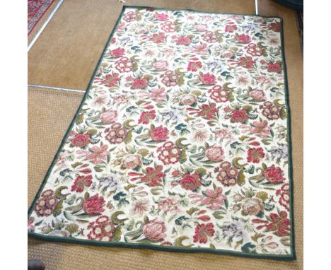 A classic style needlepoint wool rug, the field of stylised flower heads on mocca ground, 1.82 x 1.20 m to/w a crewel work ru