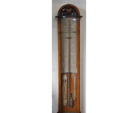 A Victorian Admiral Fitzroy forecasting barometer with printed paper scales and text within an oak Gothic style case, 105 cm 