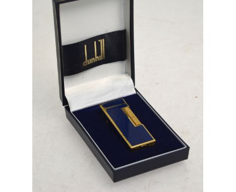 A boxed Dunhill Rollagas gilt metal cigarette lighter with simulated lapis enamel