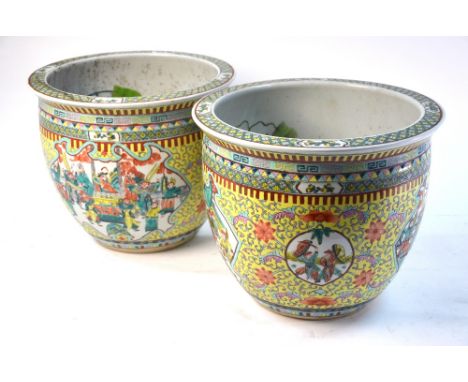 An associated pair of polychrome enamel fish bowls; each one decorated with fan-tailed goldfish in the interior, and about 37