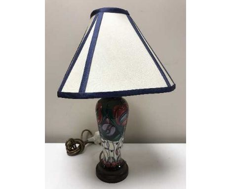 A modern Moorcroft table lamp, depicting roses, height of lamp base 23 cm with shade 