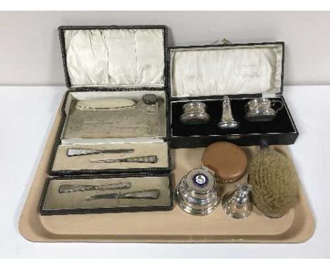 A collection of silver to include a boxed three piece cruet set (lacking spoons), a vanity case and part contents, a silver a