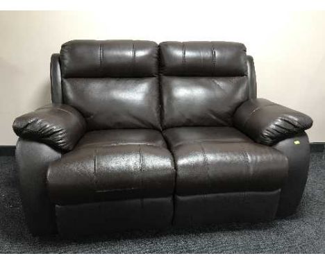 A manual reclining two seater brown leather settee 