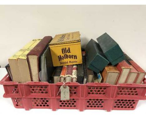 A basket of Old Holborn tin of stamps, books, guides relating to stamps, projector and screen 