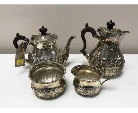 A four piece silver tea service, bearing London hall marks, 26.6oz