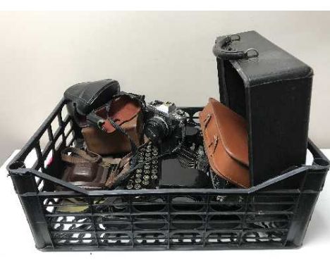 A box of cased Corona typewriter, assorted cameras, travel set in leather case 