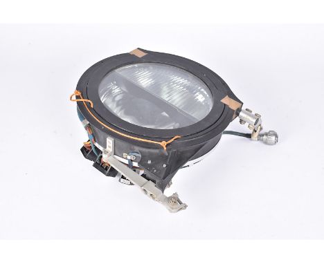 A Harley Aircraft Landing Light, model No.8ND, serial no.5210, complete in mount, 28.5cm diameter in total, together with an 