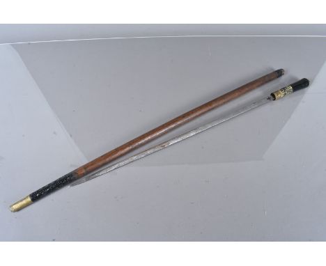 An Indian Sword stick, with twist collar release, carved top and 55cm long blade, AF