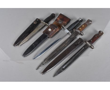 A Swiss Sig bayonet, serial 313919, complete with scabbard and frog, a Siamese type 45 with scabbard, an L1A3 with scabbard a