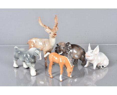 An assortment of ceramic animals, including a Beswick Stag, a Beswick Horse, Royal Doulton Elephant, and other items, some wi