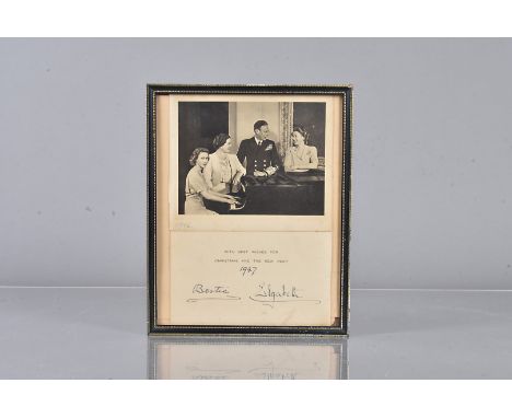 A signed 1947 Royal Christmas Card, with a black and white image of the Royal Family around the piano, comprising King George