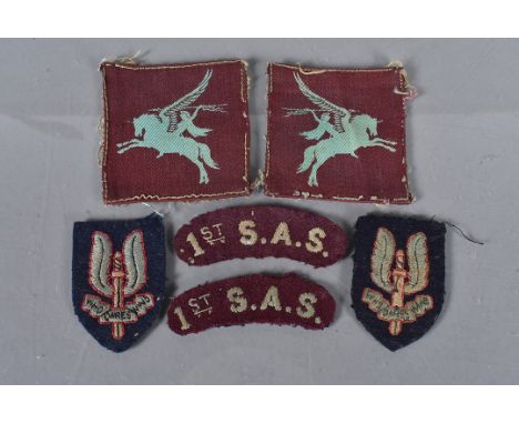 1st S.A.S attributed Special Air Service cloth shoulder titles, light blue embroidery on maroon material (slightly discoloure