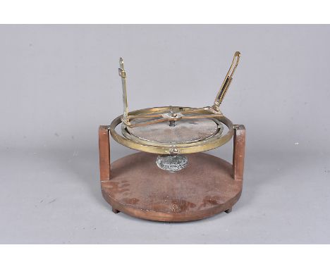A vintage marine sight compass by Buff &amp; Buff MFG, the brass compass in the gimble style, sit on wooden support, the comp