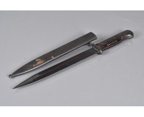 A WWII German K98 matching numbers bayonet and scabbard, the 25.5cm long blade, marked 42asw to one side and 9292c to the oth