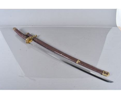 A Japanese Katana style sword,  with 65cm long blade, brass mounts and button release, complete with brown scabbard, also wit