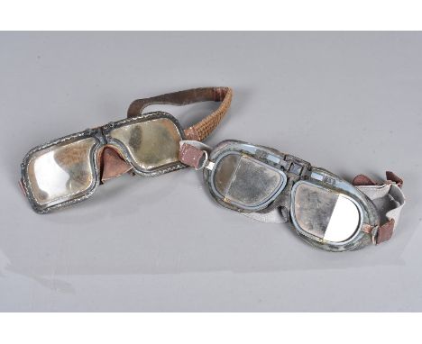 Two pair of vintage WWII period Aviation goggles, two different designs, one with leather and elastic straps (2)