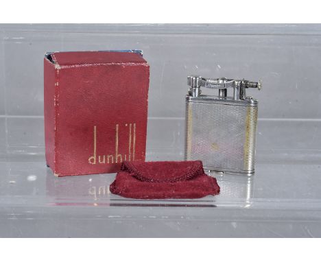 A Dunhill 'Wafer' B size petrol pocket lighter, patent number 143752, silver plated with engine turned design, in original ca