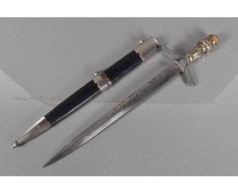 A German dagger, with an RZM M7/36 marked blade, the hilt being de-swastikaed, and stamped 456, non-standard grip, compete wi