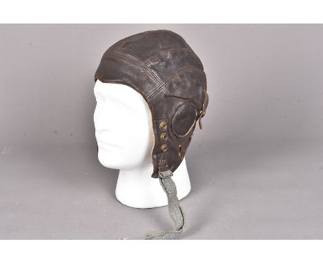 A military marked brown leather Type-C flight helmet, stamped with a broad arrow, REF No.22c/879