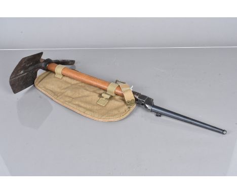 A WWII 1944 dated Entrenching Tool, date stamped to the wooden shaft and the metal base, with broad arrow, complete with atta
