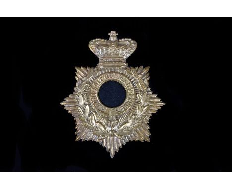 A Victorian Brass helmet plate, not containing the regiment central badge, with two loop construction to reverse, approx 13cm