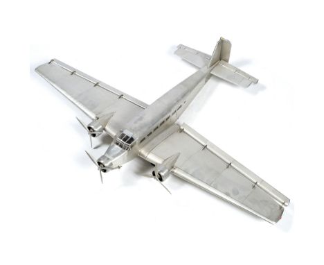 Large model of a Junker plane in&nbsp;riveted metal with three propellers and folding flaps, tip to tip is 99cm across