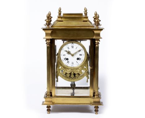 French four glass mantel clock 19th Century, with four bevelled panels on a plinth base, with Roman numerals to the face, 35.