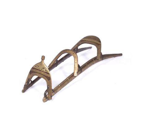 Camel saddle Rajasthan, 19th Century, with copper inlay, having a front arch pommel and two back rests, 131cm long