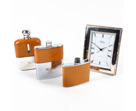 Silver mounted contemporary desk clock and three silver plated and leather hip flasks
